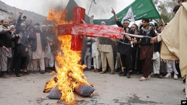 Afghans in Jalalabad  burn an effigy depicting U.S. President Barack Obama following Sunday's killing of civilians in Panjwai by a U.S. soldier. 