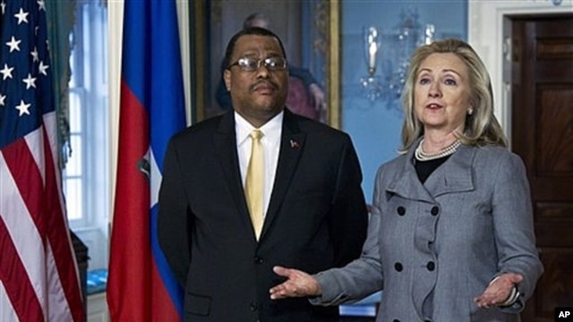 Secretary of State Clinton with Haitian Prime Minister Garry Conille in Washington, Feb. 8, 2012.