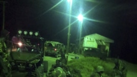 An undated handout photograph released by Kenya's Ministry of Defense on September 29, 2012, shows members of the Kenyan Defense Forces during an operation at an undisclosed location in Somalia.