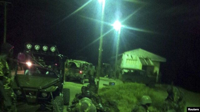 An undated handout photograph released by Kenya's Ministry of Defense on September 29, 2012, shows members of the Kenyan Defense Forces during an operation at an undisclosed location in Somalia.