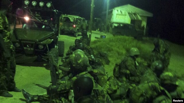An undated handout photograph released by Kenya's Ministry of Defense on September 29, 2012, shows members of the Kenyan Defense Forces during an operation at an undisclosed location in Somalia. 