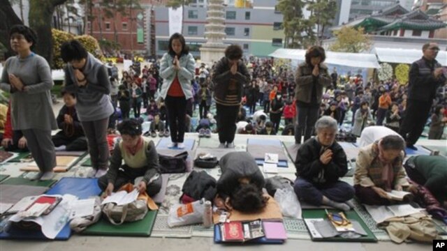 South Korean parents pray during a special service to wish for their children's success on the College Scholastic Ability Test