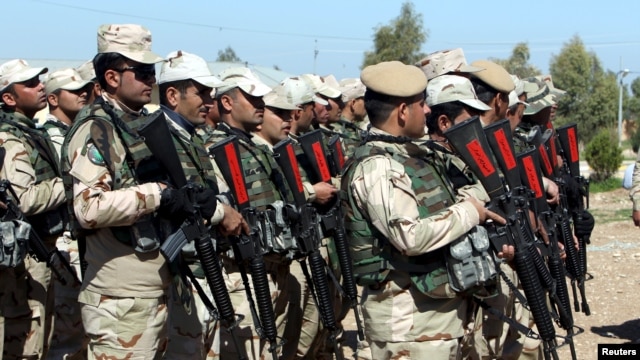 Kurdish Peshmerga fighters take part during a training session by coalition forces in a training camp in Irbil, north of Iraq, March 9, 2016.