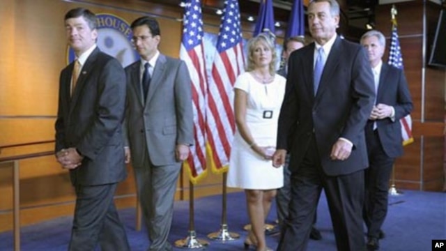 House Speaker John Boehner of Ohio, second from right, and fellow House Republicans leave a news conference on Capitol Hill in Washington, Thursday, July 28, 2011. From left are, Rep. Jeb Hensarling, R-Texas, House Majority Leader Eric Cantor of Va., Rep.