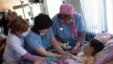 Doctors render aid to 12-year-old Gevorg Grigoryan, who was wounded in a missile barrage by Azerbaijani forces, in a hospital in Stepanakert, in the separatist Nagorno-Karabakh region, Armenia, April 2, 2016.
