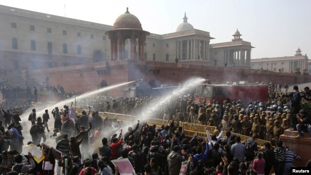 Police fire water canons on demonstrators near the presidential palace in New Delhi on Dec. 22, 2012.