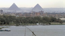 A traditional felucca sailing boat transits the Nile river passing the Pyramids of Giza in Cairo, Egypt. (file photo)