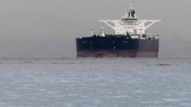 Malta-flagged Iranian crude oil supertanker "Delvar" is seen anchored off Singapore on March 1, 2012. Western trade sanctions against Iran are strangling its oil exports even before they go into effect.