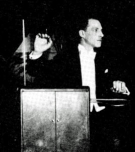 Inventor Leon Theremin playing his instrument in concert, c. 1924.