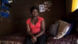 Fumana Ntontlo, 30, who says she was raped at age eight by a family member, sits in her one-room shack in Cape Town's Khayelitsha township. (file photo) 