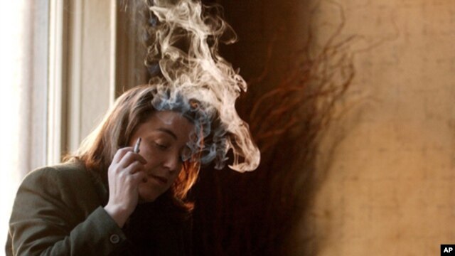 An unidentified Dubliner smokes in a pub in central Dublin, Ireland, on Jan. 30, 2003, the day Irish Health Minister Micheal Martin announced a ban on smoking in bars, restaurants and the work place.