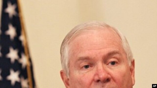 US Defense Secretary Robert Gates talks during a joint press conference with Afghan President Hamid Karzai (unseen) at the Presidential Palace in Kabul, 08 Dec 2009