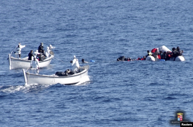 FILE - Migrants are rescued by the Italian Navy in the Mediterranean Sea, in this picture released on January 28, 2016 by Italian Navy.