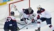 FILE - USA goaltender Jonathan Quick and defenseman John Carlson (4) defend against Slovakia defenseman Zdeno Chara (33) during the 2014 Winter Olympics men&#39;s ice hockey game at Shayba Arena, Thursday, Feb. 13, 2014/