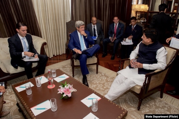 U.S. Secretary of State John Kerry, flanked by State Department Special Envoy and Coordinator for International Energy Affairs Amos Hochstein, sits with Indian Minister of Power Piyush Goyal on August 30, 2016, at the Le Meridien Hotel, in New Delhi, Indi