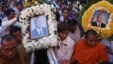 Thousands of mourners gather at the gates of the Royal Palace minutes after the coffin of former king Norodom Sihanouk arrived in Phnom Penh October 17, 2012. Tens of thousands poured into Cambodia