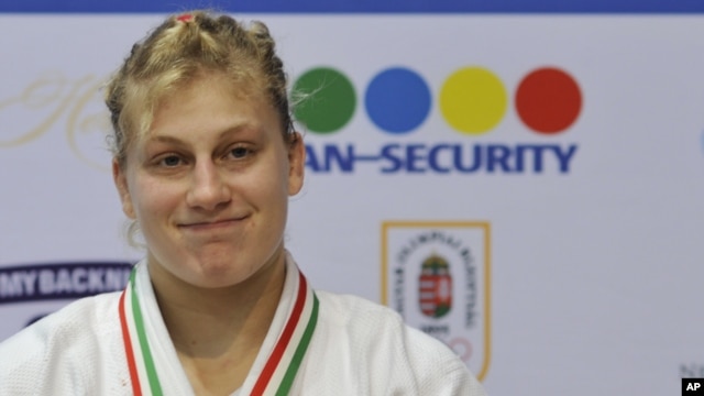 Kayla Harrison of the U.S. smiles after winning the gold medal in the women's under 78 kg category final match at the World Cup Judo tournament in Budapest, Hungary, February 12, 2012.