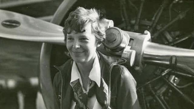Amelia Earhart with her Lockheed Vega airplane