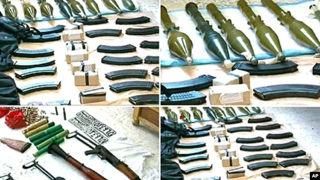 The Syrian official news agency SANA shows weapons that were found in the province of Homs, Syria, September 27, 2011.