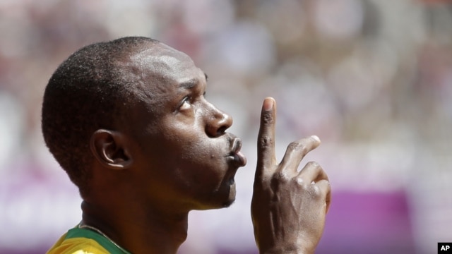 Jamaica's Usain Bolt gestures before competing in a men's 100-meter heat in London, August 4, 2012.