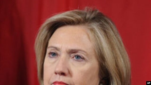 U.S. Secretary of State Hillary Clinton listens as China's Vice Premier Wang Qishan delivers closing remarks during the 2011 US-China Strategic Economic Dialogue in Washington, D.C., May 10, 2011