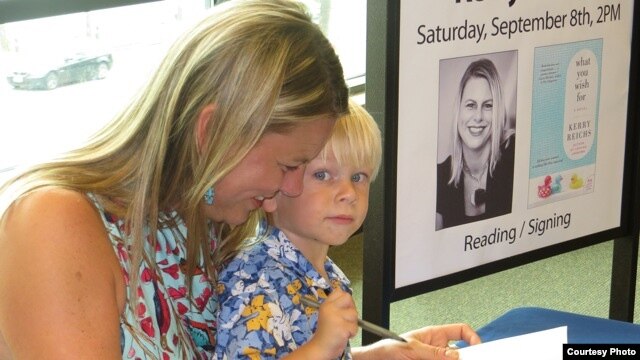 Author Kerry Reichs with her son Declan at a book signing event for 