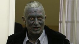 Candidate Vladimir Franz arrives to cast his vote for the presidential elections at a polling station in Prague, Jan. 11, 2013.