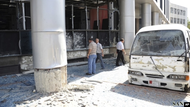 Photo released by Syria's national news agency shows wreckage of a bus after a bombing in the al-Zablatani area, Damascus, October 9, 2012.