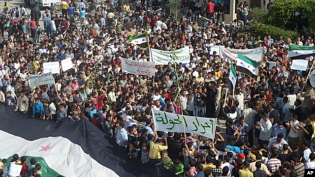 Demonstrators protest against Syria's President Bashar al-Assad in Hula, near Homs, October 27, 2011.