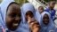 Schoolgirls play outside El-Kanemi Islamic School in Maiduguri.
