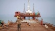 Workers from Indian conglomerate Essar Group construct a new port  in Sittwe in Rakhaine state, Burma, May 19, 2012. 