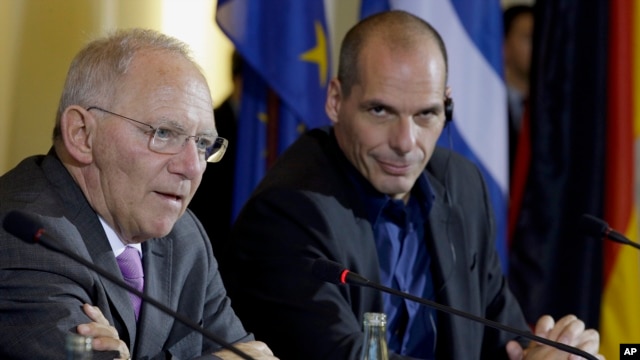 German Finance Minister Wolfgang Schaeuble, left, and Greece Finance Minister Yanis Varoufakis address the media during a joint press conference as part of a meeting in Berlin, Germany, Feb. 5, 2015. 