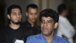 Abdullah al-Senussi, head of the Libyan Intelligence Service speaks to the media in Tripoli, August 21, 2011.