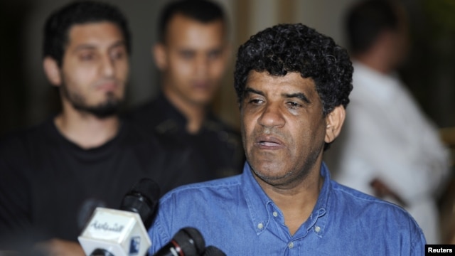 Abdullah Al-Senussi, head of the Libyan Intelligence Service speaks to the media in Tripoli August 21, 2011. 