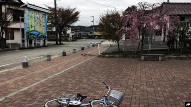 A bicycle is left near a station in the part of Minamisoma town that is inside the 20-kilometer evacuation zone in Fukushima Prefecture, Japan, April 21, 2011.