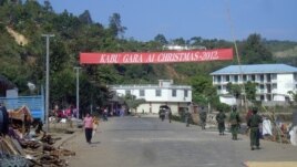 Soldiers of the ethnic Kachin Independence Army (KIA) patrol in downtown Laiza, northeastern Burma, January 4, 2013. 