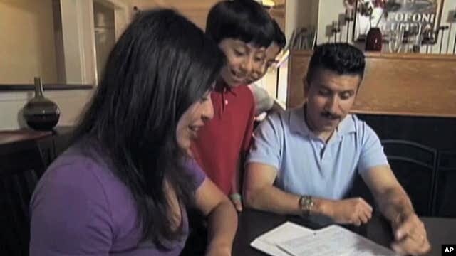 Latino-American family filling out census form