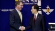 U.S. Defense Secretary Ash Carter, left, shakes hands with his South Korean counterpart Han Min Koo after a joint news conference at the Defense Ministry in Seoul, South Korea, April 10, 2015. 
