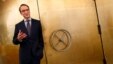 Germany's federal reserve Bundesbank President Jens Weidmann stands beside the door of a giant safe as he poses for a photograph at the money museum next to the Bundesbank headquarters, in Frankfurt, Germany, May 17, 2013.