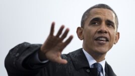 President Barack Obama speaks at a campaign event at rainy Cleveland State University, Friday, Oct. 5, 2012.