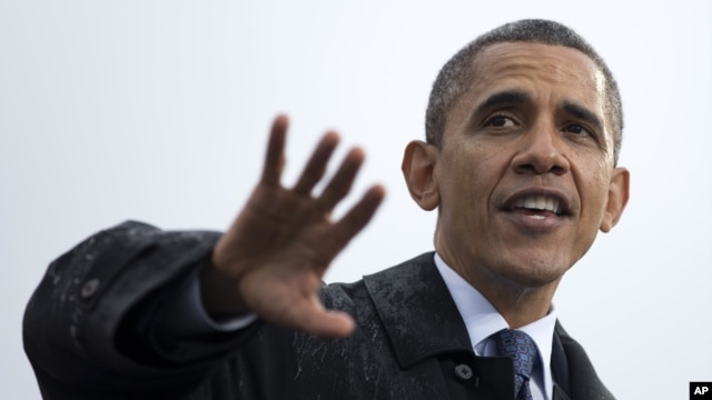 President Barack Obama speaks at a campaign event at rainy Cleveland State University, Friday, Oct. 5, 2012.