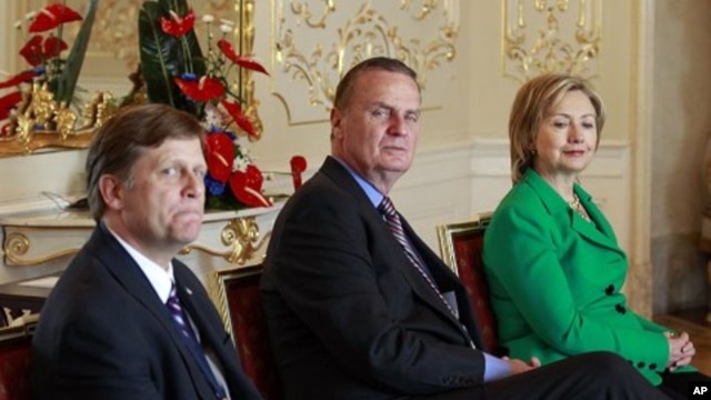 In this photo taken April 8, 2010, Michael McFaul, from left, the administration's top Russian expert, is seen with National Security Advisor Gen. Jim Jones, and Secretary of State Hillary Rodham Clinton, during a photo opportunity prior to a bilateral me