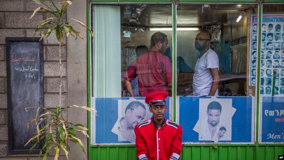  FILE - A security guard sits near a gate in Addis Ababa, Ethiopia, on October 10, 2016. A state of emergency in effect in Ethiopia since October 8 is being used broadly to silence critical media voices and lock up suspected dissidents, according to a range of reports coming in from the country.