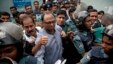FILE - Bangladeshi newspaper editor Mahmudur Rahman, center, is brought to a court following his arrest on various charges in Dhaka, April 11, 2013. Offcials say they'll question him in an alleged conspiracy case involving the prime minister's son.