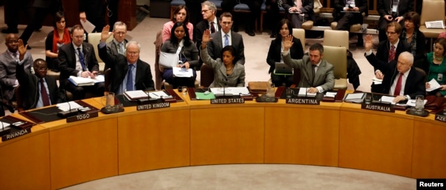 Members of the United Nations Security Council vote to tighten sanctions on North Korea in New York, Mar. 7, 2013.