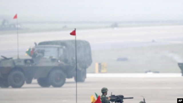 Soldiers in armored vehicles take part in an anti-airborne drill as part of the annual Han Kuang military exercise at the Chingchuankang Air Force Base in Taichung, central Taiwan, April 14, 2011.