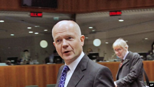 Britain's Foreign Secretary William Hague arrives at a European Union foreign ministers meeting at the EU Council headquarters in Brussels, December 1, 2011