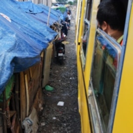 A train moves out of Phnom Penh along the refurbished line running south to the town of Touk Meas in late October. The homes of people living alongside the track will be demolished in due course.