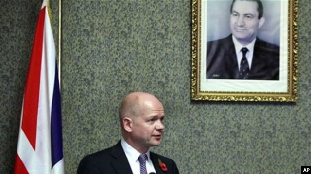 British Foreign Secretary William Hague, looks on during a presser under a poster showing Egyptian President Hosni Mubarak at the Foreign ministry in Cairo, Egypt (File Photo).