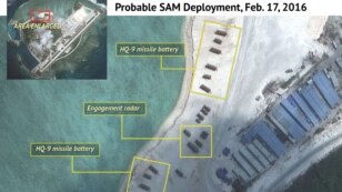 Satellite imagery analysis by geopolitical intelligence firm Stratfor shows probable surface-to-air launcher batteries and associated radar by China on Woody Island in the South China Sea. (Courtesy of Stratfor)